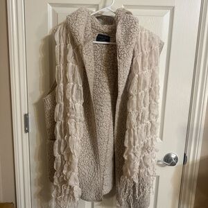 Large Cream Sherpa Vest with wavy beige scarf. Vest has pockets.